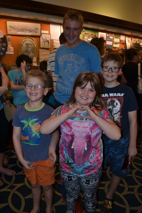 WAITING: Caeden Dawes, 7, Jorja, 8, and Alex Lewis, 11, and (back) Blaine Dowes were spotted in the long line to go to the show. 012017nmshow2