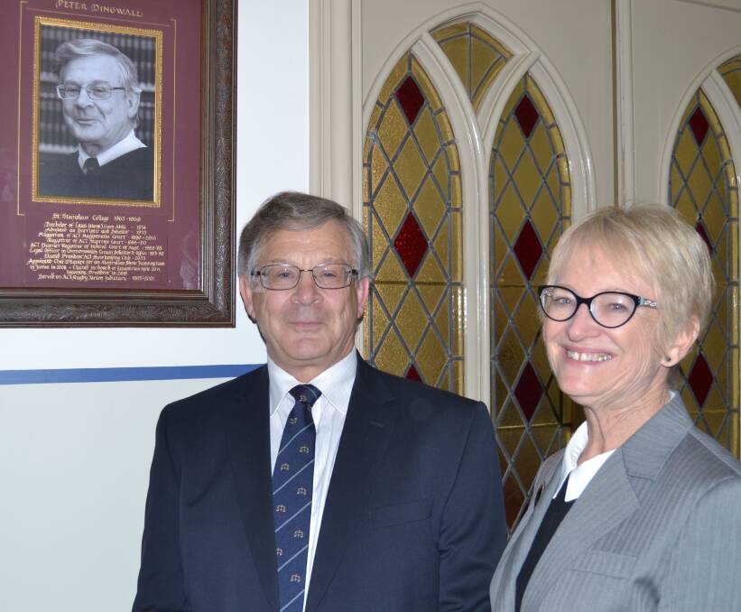RECOGNITION: Retired ACT magistrate and ex St Stanislaus' College student Peter Dingwall's photo was recently added to the college's Old Boy Gallery. He is pictured with head of college Dr Anne Wenham. Photo: NADINE MORTON 081216nmoldboy1
