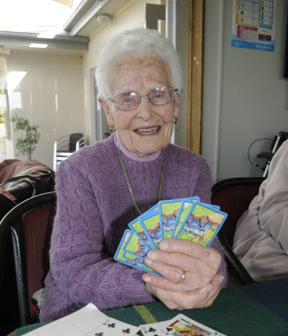 SWEET LIFE: Frances Morris celebrated her 99th birthday surrounded by friends for a game of '500' at Bathurst Golf Club on Tuesday. Photo: CHRIS SEABROOK 071216c99bday