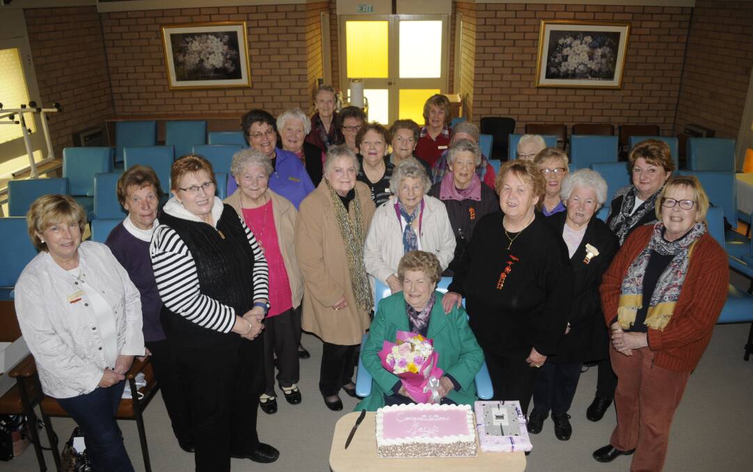 GUEST OF HONOUR: Members of Macquarie Care Centre Auxiliary celebrated Maisie Scott (seated) being awarded an Order of Australia medal.
