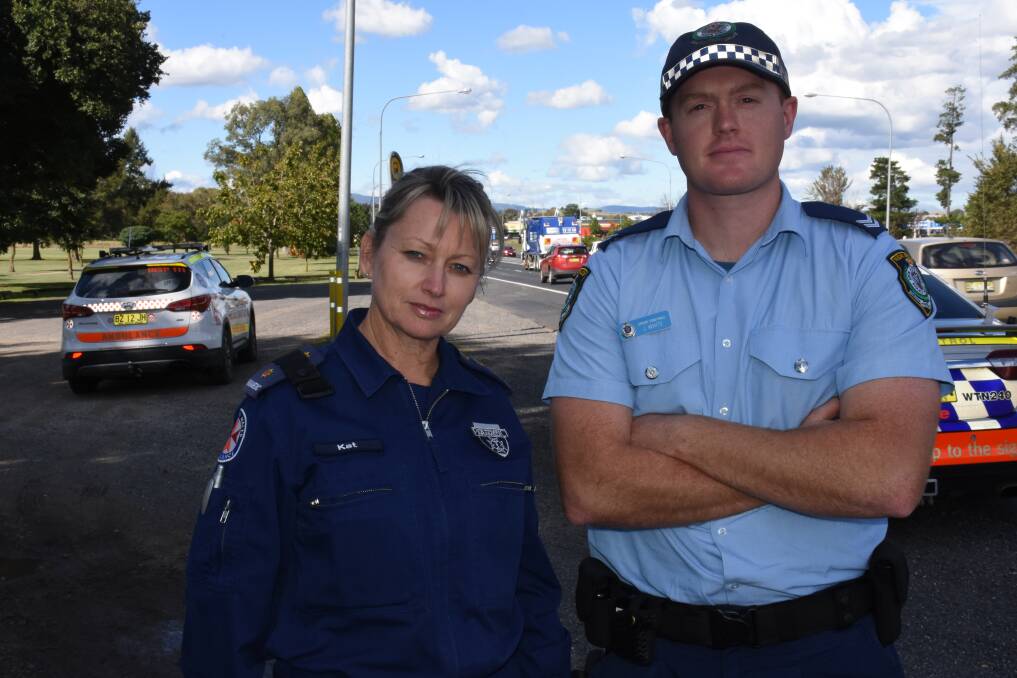 STAY SAFE: Ambulance Service of NSW Inspector Kathy Golledge and Bathurst Traffic and Highway Patrol Command Senior Constable Josh White have teamed up to ask motorists to slow down. Photo: NADINE MORTON 041217nmpoints2