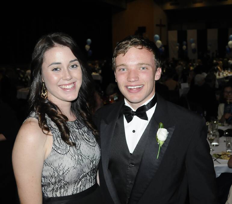 LOTS OF LAUGHS: Grace Behsman and Brendan Nelson kicked up their heels at the Stannies Graduation ball. 	092113cssc13