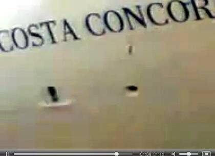 Portent of doom ... Grainy amateur footage aired by Italian media shows the champagne bottle bouncing off the side of the Costa Concordia during its christening ceremony in 2006.