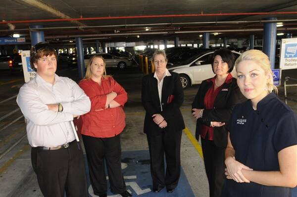 CAR PARK ANGER: Jessie Caldwell of Bathurst Real Estate, Bec Seaman and Beryl Parkes of FrontRunner Mortgage Group, Nicci Mackey of Bathurst Real Estate and Karla McDiarmid of Macquarie Skin and Day Spa are among those angered by changes introduced by Secure Parking to the Bathurst Chase car park. Photo: CHRIS SEABROOK 	032812cparkng1