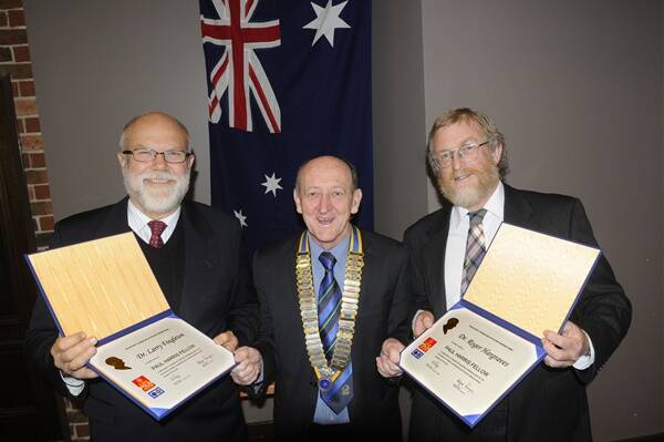 SERVICE BEYOND SELF: Rotary Club of Bathurst East president Terry Mahony, centre,  presents Dr Larry Fingleton and Dr Roger Hargraves with their respective Paul Harris Fellow awards. Photo: CHRIS SEABROOK	 053012crotary1a