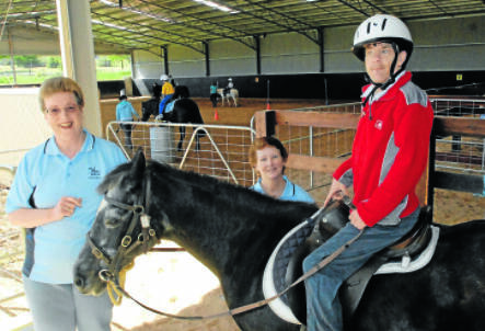 READY TO RIDE: Bathurst RDA president Nola Ramsey, secretary Shirley Walsh, RDA rider Peter Francia and Bess the horse are all ready for NSW Governor Professor Marie Bashir to join their celebrations in Bathurst tomorrow. Photo: PHILL MURRAY 102210prda