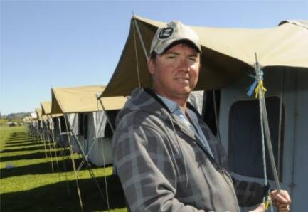 READY FOR THE MASSES:  Darren Turner from Tent City Hire helped constructed around 350 tents at Police Paddock ahead of the Bathurst 1000.  Photo:  PHILL MURRAY  092910ptent