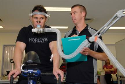 HEALTH KICK:  CSU human movement PhD student Cheyne Donges (right) testing the health benefits of cycling with Andrew Morcom.  Photo:  ZENIO LAPKA  092710zbike1