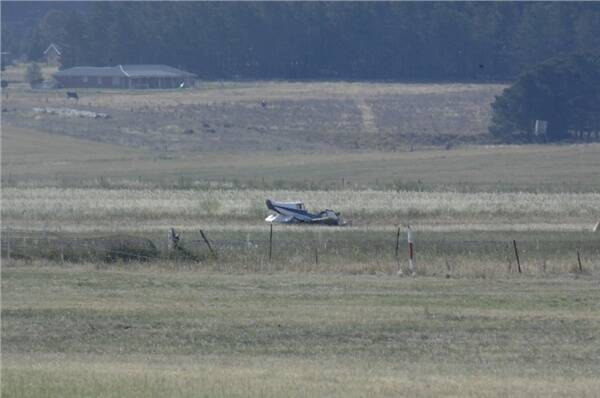 CRASH: The badly damaged Lancair two-seater at the side of the runway at Bathurst Airport late yesterday. Photo: ZENIO LAPKA