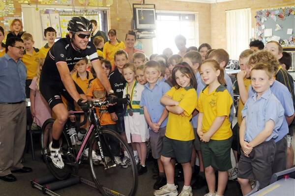 ON A ROLL:  Professional cyclist Dean Windsor pedals his message of trying to get more children cycling to children at the Assumption School.  Photo:  PHILL MURRAY102910pdean