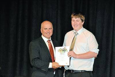 TOP ACHIEVER: Education Minister Adrian Piccoli congratulates Lyndon Wass for finishing first in the state in automotive examination.