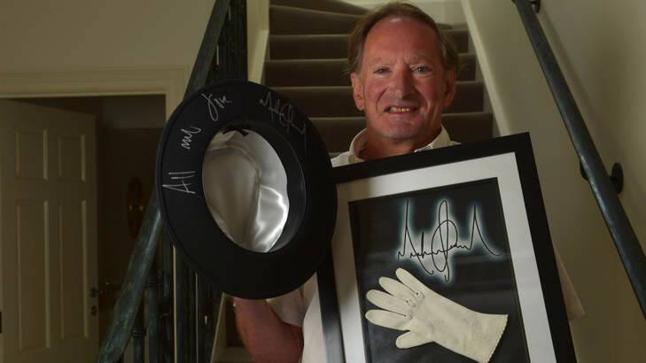 Collector of signed celebrity items Tim Fredman with a hat worn by Michael Jackson and one of the star's inner gloves. Photo: Michael Clayton-Jones