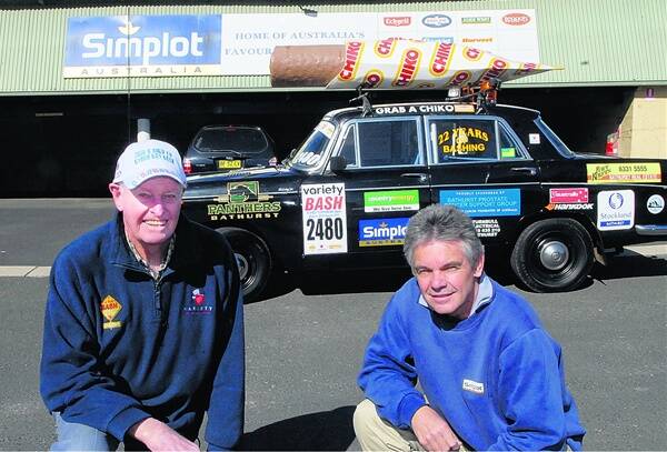 GETTING READY: Ray Stapley (right) from Simplot and John Lindsell with his 1964 Chiko Wolseley, which he is driving in this year's NSW Variety Club Bash. Photo: PHILL MURRAY 081810pchico