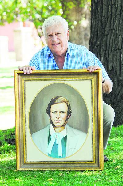 LOCAL LINKS: Debater Paul Hennessy with a painting of Ben Hall by the late Reg Campbell. Photo: ZENIO LAPKA 032210zhennessey