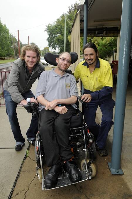 INSPIRING: Lindsay Cottee (centre), with his mates Charlie Biddle and Dale Stapleton, at the Farmer’s Arms Hotel, which will become the headquarters for his epic journey across Australia. Photo: PHILL MURRAY 	022912plindsay1