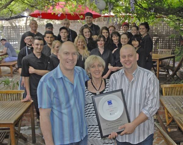 AUSTRALIA’S BEST BREAKFAST: Lindsay and Sue Gale and Ross McDonald with the team at The Hub who have been awarded the title of the best breakfast restaurant in Australia. Photo: PHILL MURRAY 102511phub2