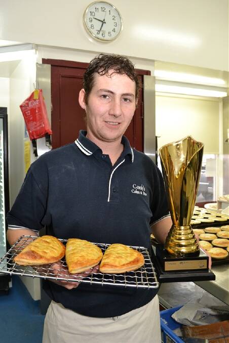 THAT'S GOLD: Carah’s Cakes and Pies pastry chef manager Tim Hall shows off his team's award-winning salmon pasties and their trophy from The Great Aussie Pastie Competition. 