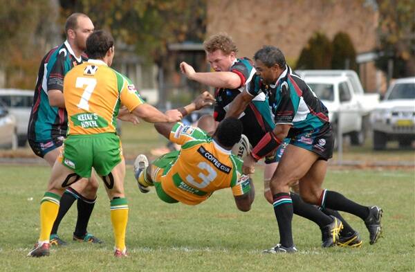 BANG: CYMS centre Epa Navale on the end of a huge hit from Brent Seager on Sunday as Panthers produced their second victory of the season, winning 32-16 at Carrington Park. Photo: ZENIO LAPKA 	052712zpanth1