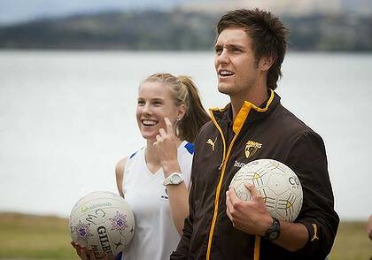 Round ball talk: Jack Gunston with netball fans during ''Walk with a Hawk'' in Hobart.