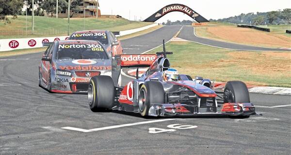GREEN LIGHT: Bathurst Regional Council is set to give the green light for a publicity stunt which would see Forumla One star Jenson Button and V8 Supercar ace Craig Lowndes swap cars before tackling the iconic Mount Panorama circuit next month. Image digitally enhanced