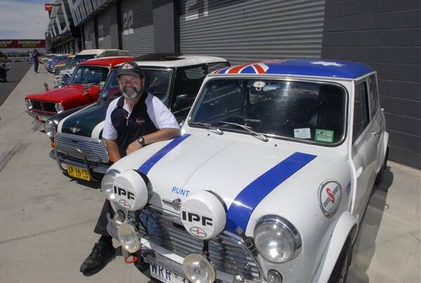 MINI ANNIVERSARY: Neil Crawford from Bairnsdale, Victoria, with his Mini-Cooper S taking part in the Oz50 Mini Carnival rally to Mount Panorama. Photo: PHILL MURRAY