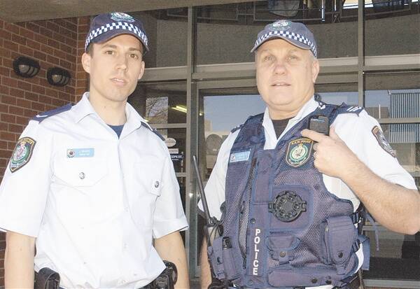 BEFORE AND AFTER:  Constable Jason Marks and Senior Constable Paul Rasmussen show the difference between an officer wearing a Load Bearing Vest and one who is not.  Photo:  BRENDAN ARROW.  081710bacopvests2