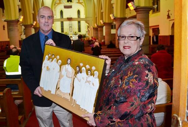 SUPPORTING THE PROJECT: Glen Smith and Monica Morse are hoping the Catholic Diocese of Bathurst can raise the $3 million needed to complete the heritage restoration. 	062912zcatholic1