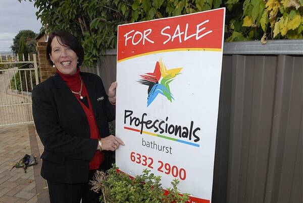 HOUSING HOT SPOT: The Professional sales consultant Chris Boserio with one of the properties recently sold in South Bathurst. Photo: PHILL MURRAY 050311pchris