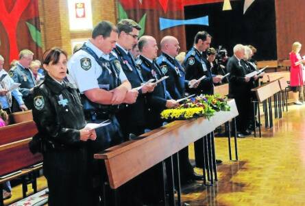 REMEMBER THEM: Police, emergency services personnel and community members gathered in All Saints’ Cathedral yesterday to mark National Police Remembrance Day. Photo: PHILL MURRAY 092901prem