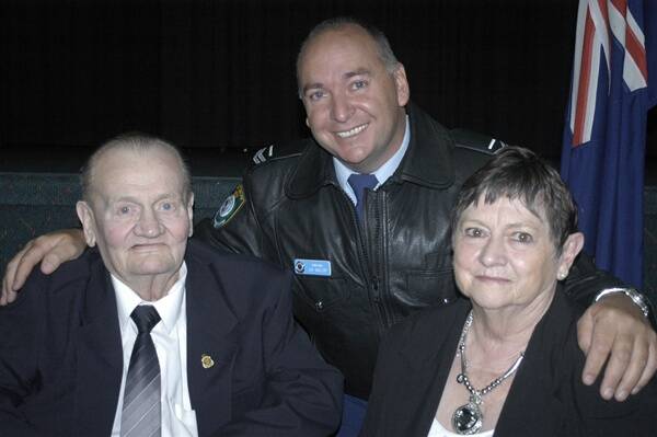 PROUD MOMENT: The parents of the late Sergeant Paul Quinn, Brian and Barbara, with the inaugural winner of the Paul Quinn Award, Acting Sergeant John Gallop. Photo: BRIAN WOOD 	051712bwquinn
