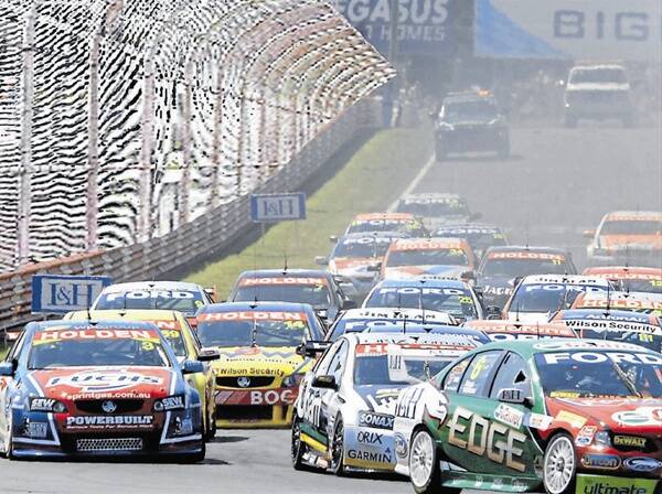 SIGN OF THE TIMES: An artist’s impression of how Pit Straight at Mount Panorama will look in the future when debris fencing is installed at the iconic circuit.	 050312fence