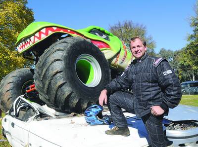 PARKING? NO PROBLEM: Driver of the Raptor, Corey Clarke, who will star in Saturday night's six Monster Truck spectacular in Bathurst. Photo: CHRIS SEABROOK 051210cmonstr2