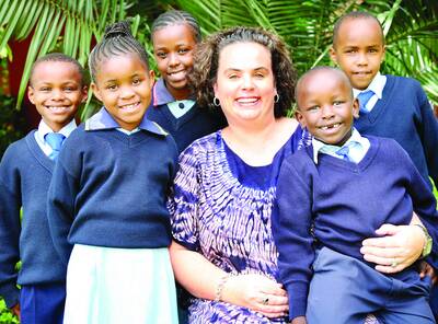 COMING TO BATHURST: Gemma Sisia, founder of the School of St Jude in Tanzania with some of the children whose lives she has changed. Gemma will speak in Bathurst this evening. 031510gemma