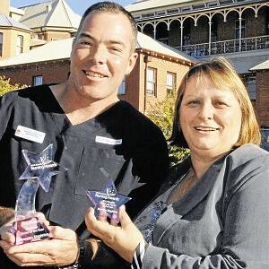 ONE IN A MILLION: Bathurst's Brenden Stapleton, who has been named the Graduate Nurse of the Year, is pictured with his award and Bathurst Health Service director of nursing Glenda Entwistle.