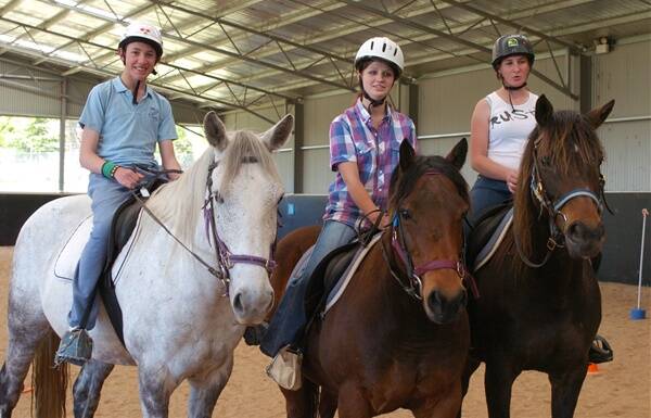 MAJOR BENEFICIARY: The Riding for the Disabled Association will receive the proceeds of the My Recipe Rules cook off on Saturday. Pictured are Corey Smith on Bluey, Ashley Elphick on Commanchee and Tiarna Chapell on Django. Photo: ZENIO LAPKA 102111zrda