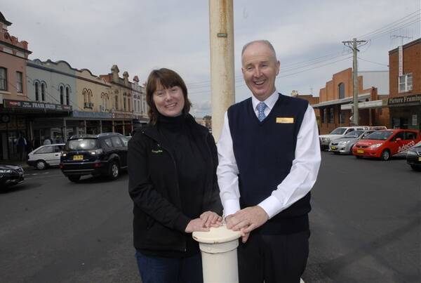 VICTORY: Keppel Street business owners Cathy Yeoman and Robert Forbutt are excited that traffic will soon be able to travel straight through the Stewart Street intersection. Photo: PHILL MURRAY