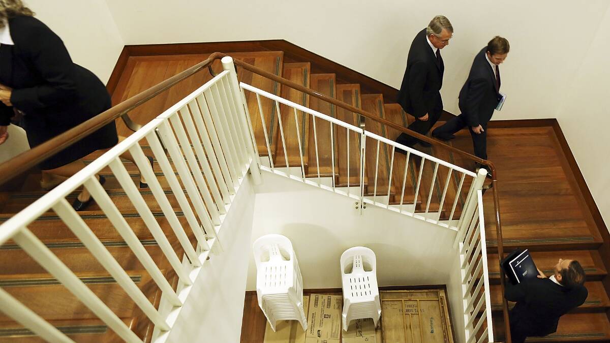 Treasurer Wayne Swan walks between rooms in 'Budget lock up'. Photo: Getty Images