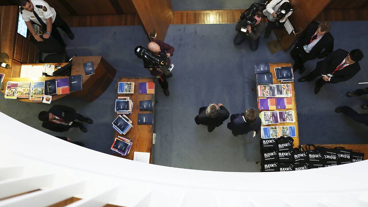 Treasurer Wayne Swan walks between rooms in 'Budget lock up'. Photo: Getty Images