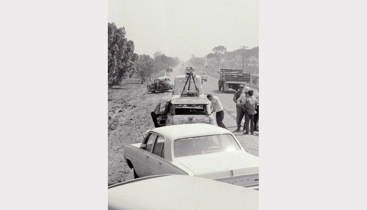 Six people died in these three cars, or trying to escape from them when the fire struck across the Geelong Road, near Lara in 1969. Photo: FAIRFAX ARCHIVES