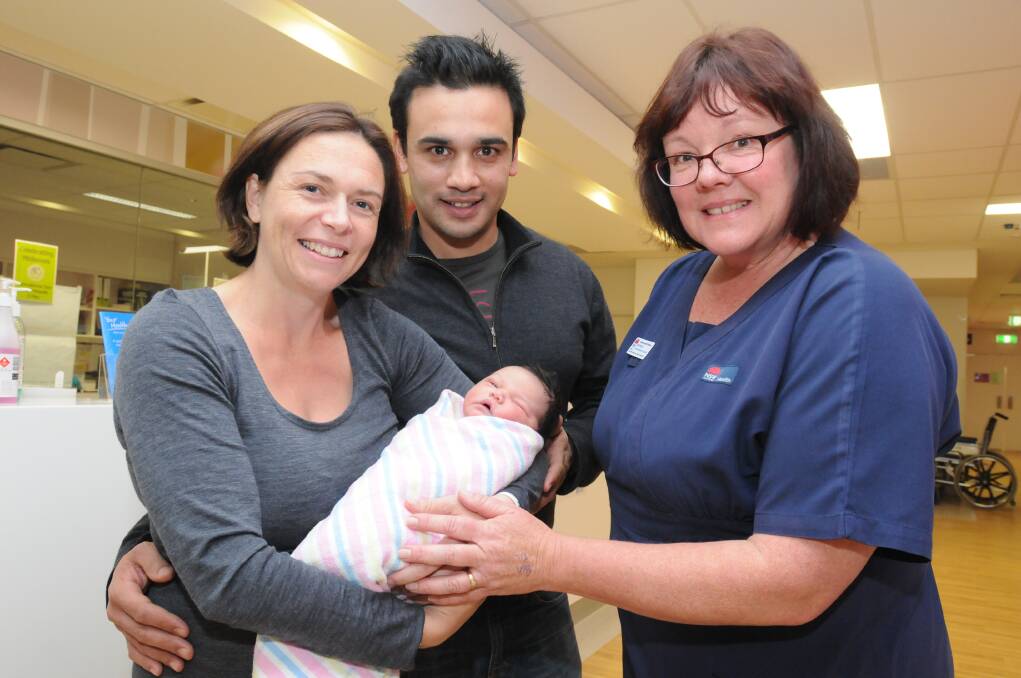 FERTILE CITY: Libby, Dottie and Justin Johnson with Orange hospital clinical midwifery educator Michelle Johnston. Orange had the most babies born for a regional centre in NSW last year. Photo: JUDE KEOGH 0518maybabies4