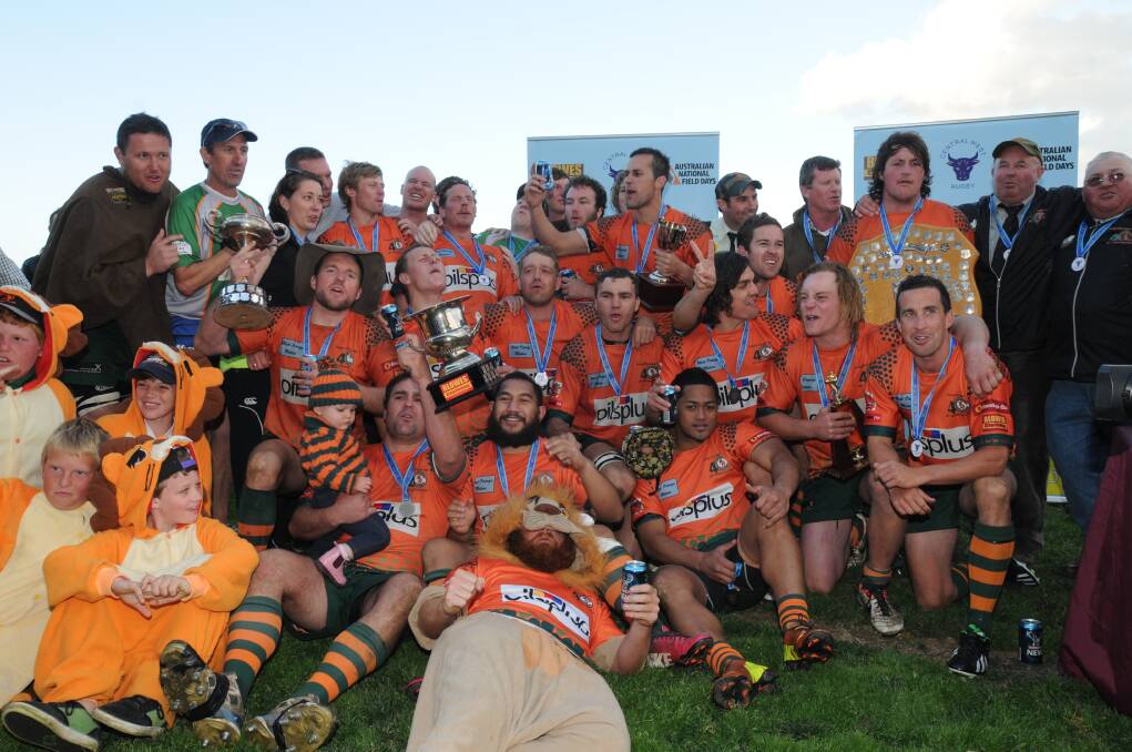 SECOND COMING: Orange City Lions lap up their second-straight Blowes Clothing Cup first grade premiership on Saturday after beating Parkes Boars 32-16 at Pride Park. Photo: STEVE GOSCH 0914sgrugby15