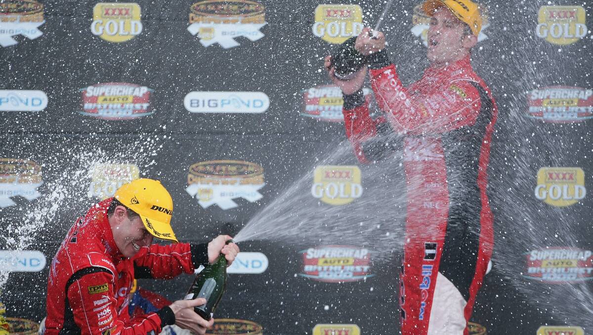 2009: Garth Tander and Will Davison celebrate on the podium after winning the Bathurst 1000. Photo: Getty Images
