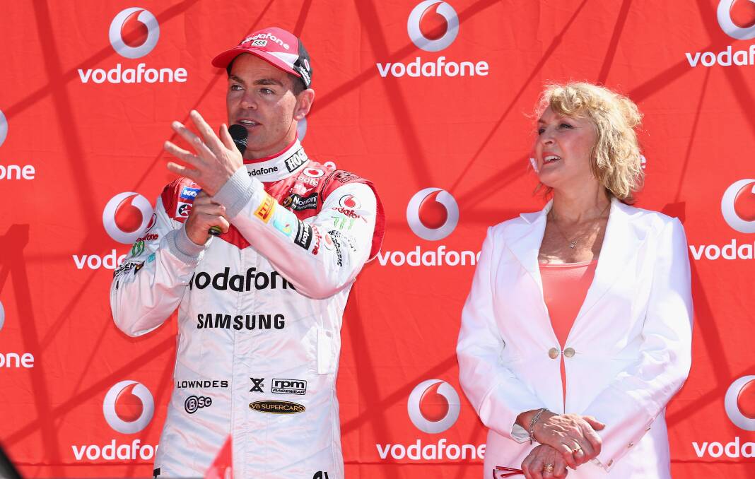 Craig Lowndes and Bev Brock unveil Team Vodafone's retro Bathurst livery ready for the weekend. Photo: Getty Images. 