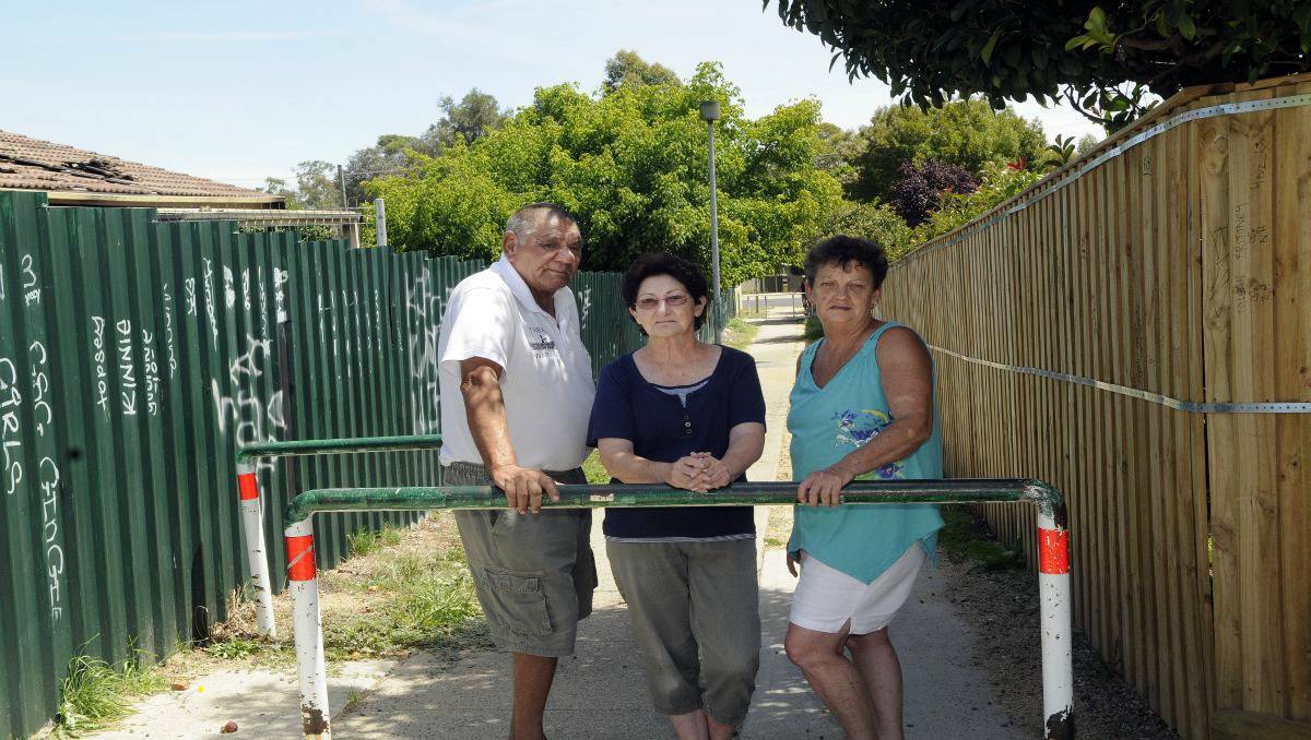 Long time Kelso residents Roy Blight, Susan Francis and Rhonda Pearse in the lane they say needs to be closed. Photo: PHILL MURRAY