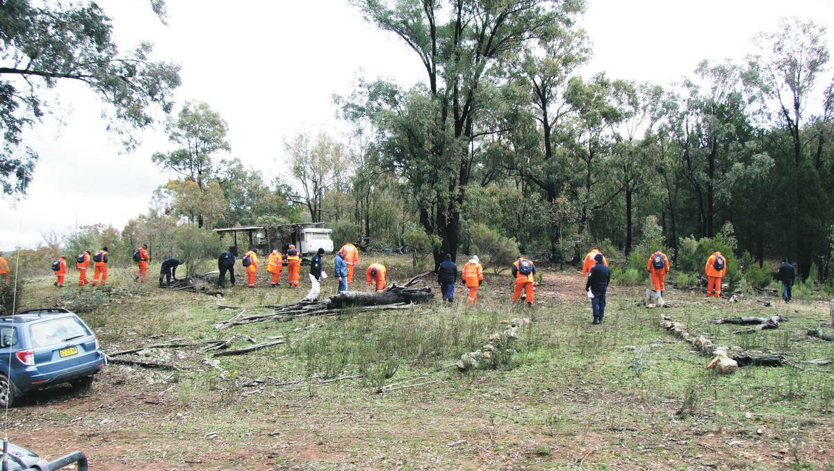 June 2009: SES volunteers searching the area where the remains were found.