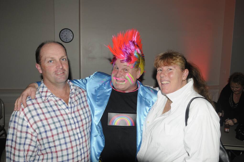 More than 200 gathered at the Bathurst RSL for an 80s and 90s themed disco. Andy Wheeler (center) with Wayne and Raylene Brand. 