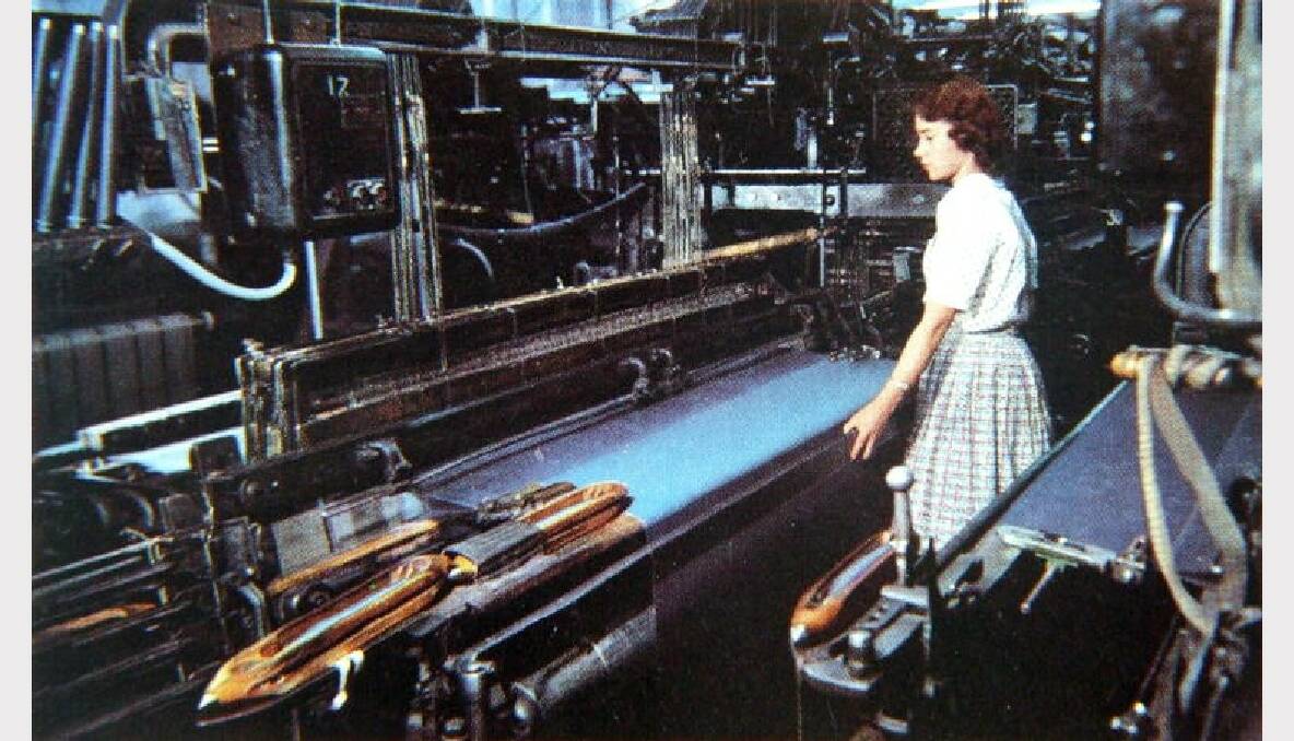 A woman viewing a loom in operation at Macquarie Worsted Mills, 1960. Photo: The Collections of Central West Libraries.