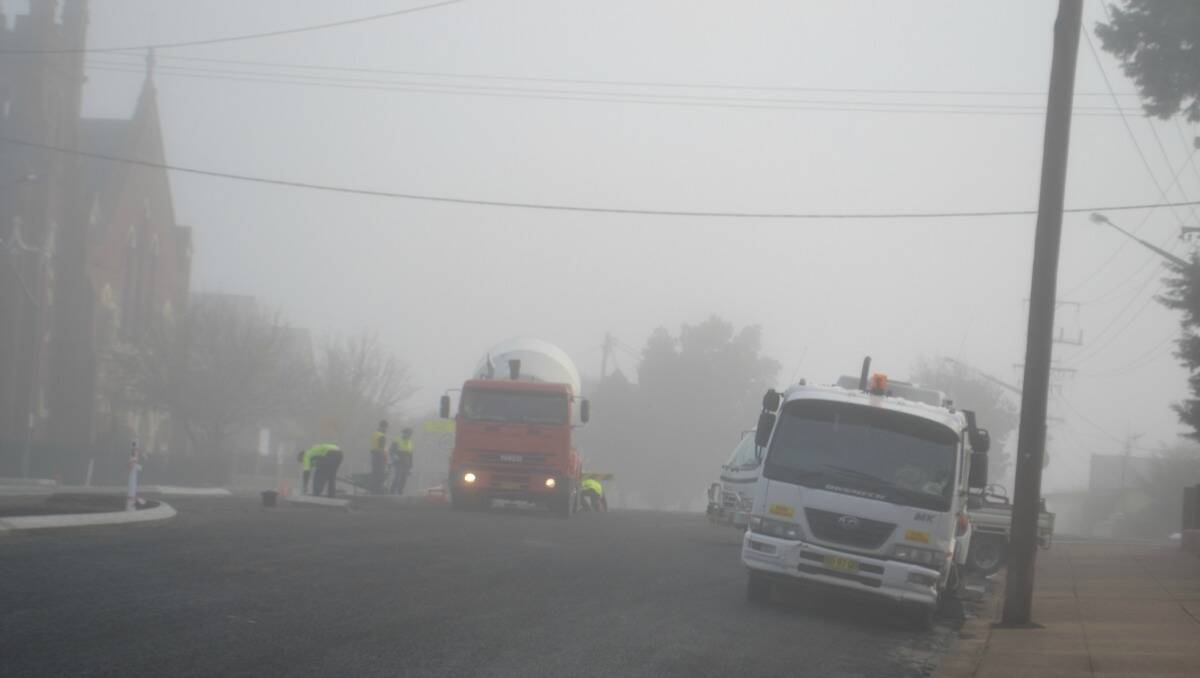 May 17 saw a foggy morning in Wellington, especially for these council workers in Percy Street. Photo: Farren Hotham