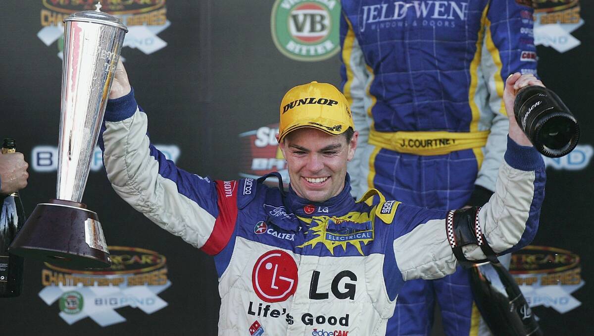 2006: Craig Lowndes of Team Betta Electrical holds the Peter Brock Trophy aloft after winning the V8 Supercars Bathurst 1000. Photo: Getty Images. 