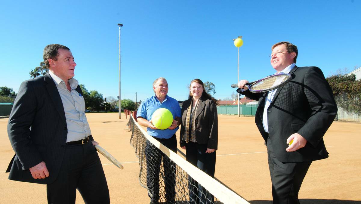 DUBBO: NSW Minister for Sport Graham Annesley has a hit with State Member Troy Grant while Muller Park Tennis Club president Ken Bailey and secretary Anne Barwick watch on. Photo: LOUISE DONGES